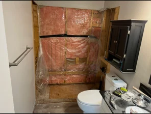 Bathroom stripped to the studs with vapour barrier over new insulation, before renovation, Regina SK