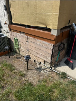 Rotted and weathered wood deck skirting before replacement, Regina SK